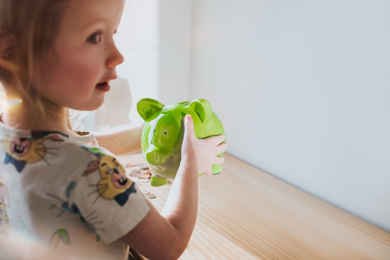 Girl with piggy bank