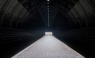 Catwalk covered in large typed paper