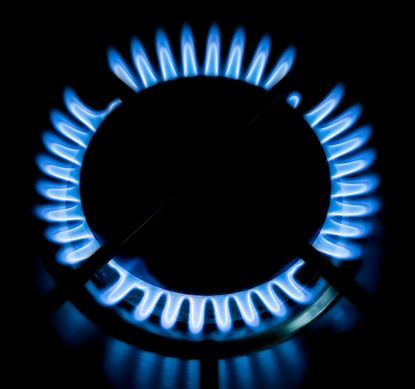 Circular blue gas flame on the hob