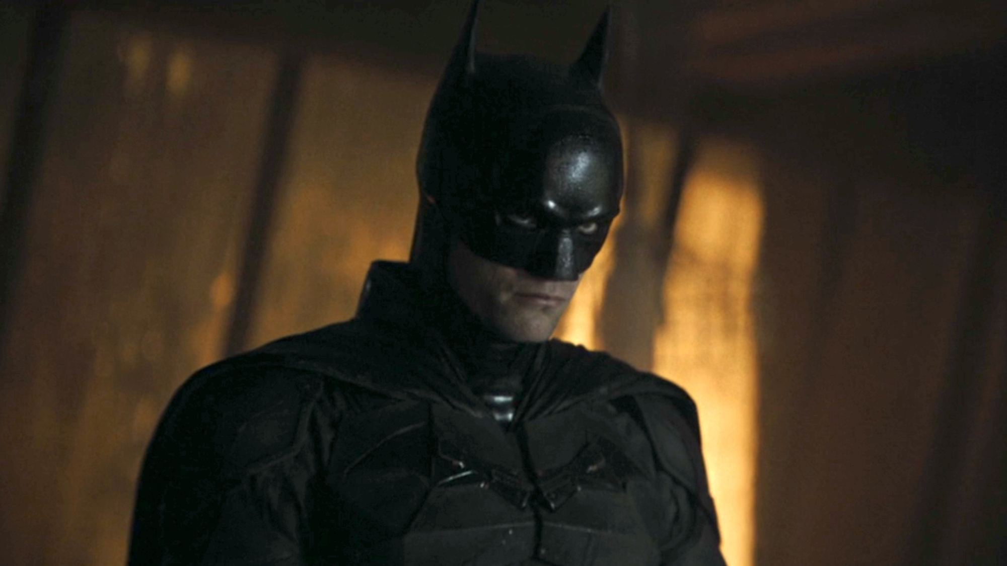 Batman (Robert Pattinson) looks ahead in The Batman.