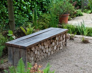 outdoor bench with a log store built underneath
