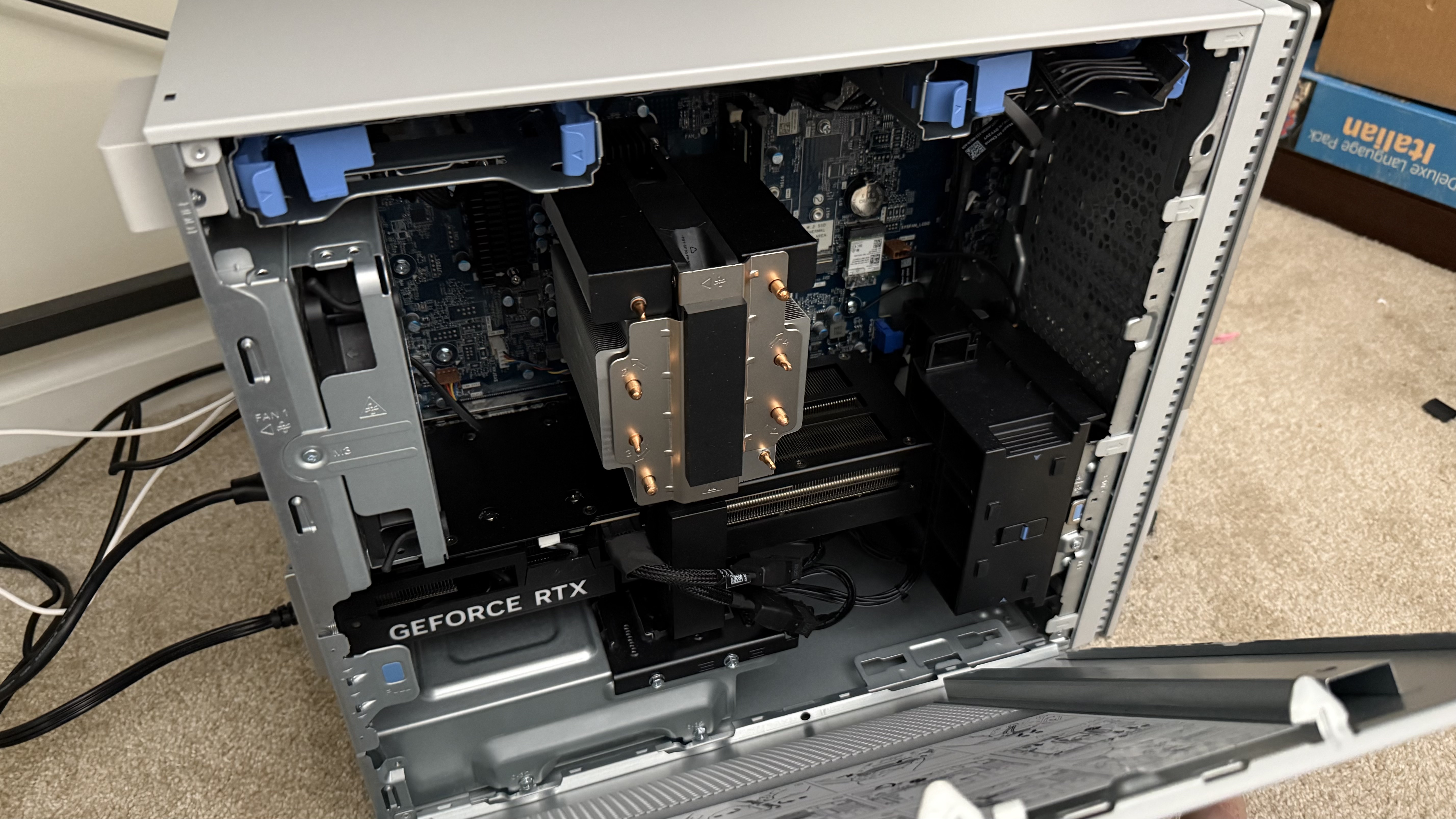 Dell Tower Plus desktop with its side panel taken off to reveal components