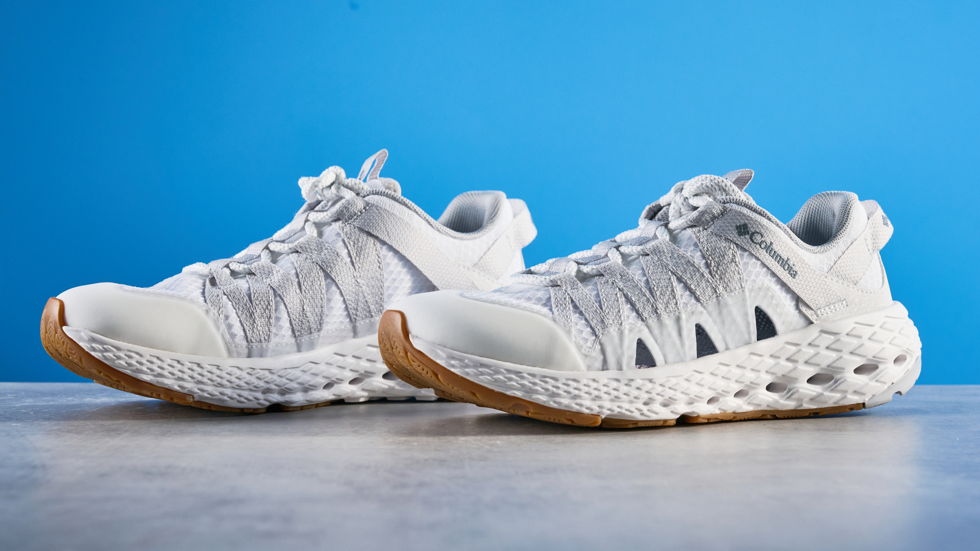 Columbia Drainmaker in white photographed in front of a blue background