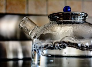 boiling water in a transparent teakettle