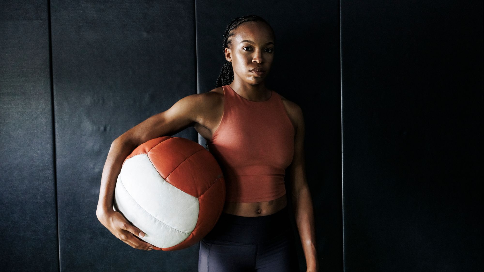 A woman strength training at a gym