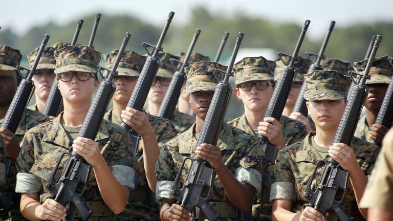 Soldier, Social group, Gun, Military uniform, Uniform, Headgear, Team, Military organization, Military, Troop, 