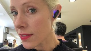 TechRadar senior audio writer Becky Scarrott wearing UE Fits earbuds