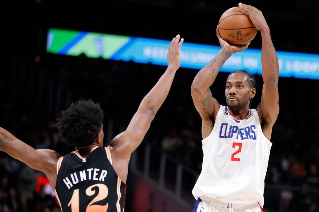 Kawhi Leonard #2 of the LA Clippers takes a shot over De&#039;Andre Hunter #12 of the Atlanta Hawks during the second half at State Farm Arena on January 28, 2023 in Atlanta, Georgia