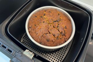 Step-by-step photo of a Christmas cake being baked in an air fryer - step 4, checking if the cake is done