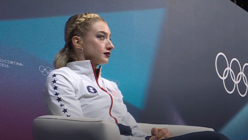 Amber Glenn nervously sits in the leader's chair at the Olympics.