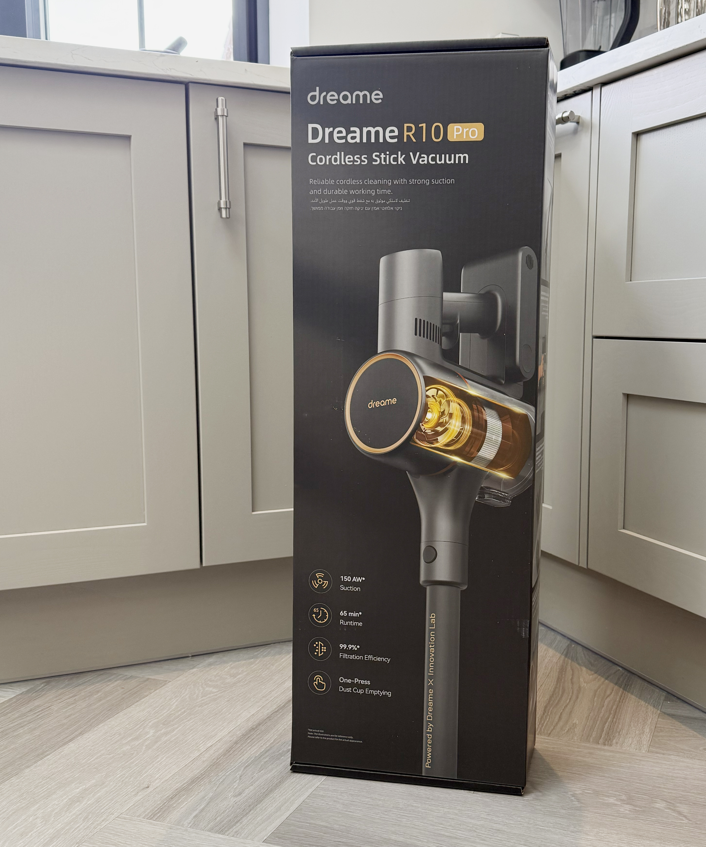 Dreame R10 Pro cordless stick vacuum box standing on a kitchen floor