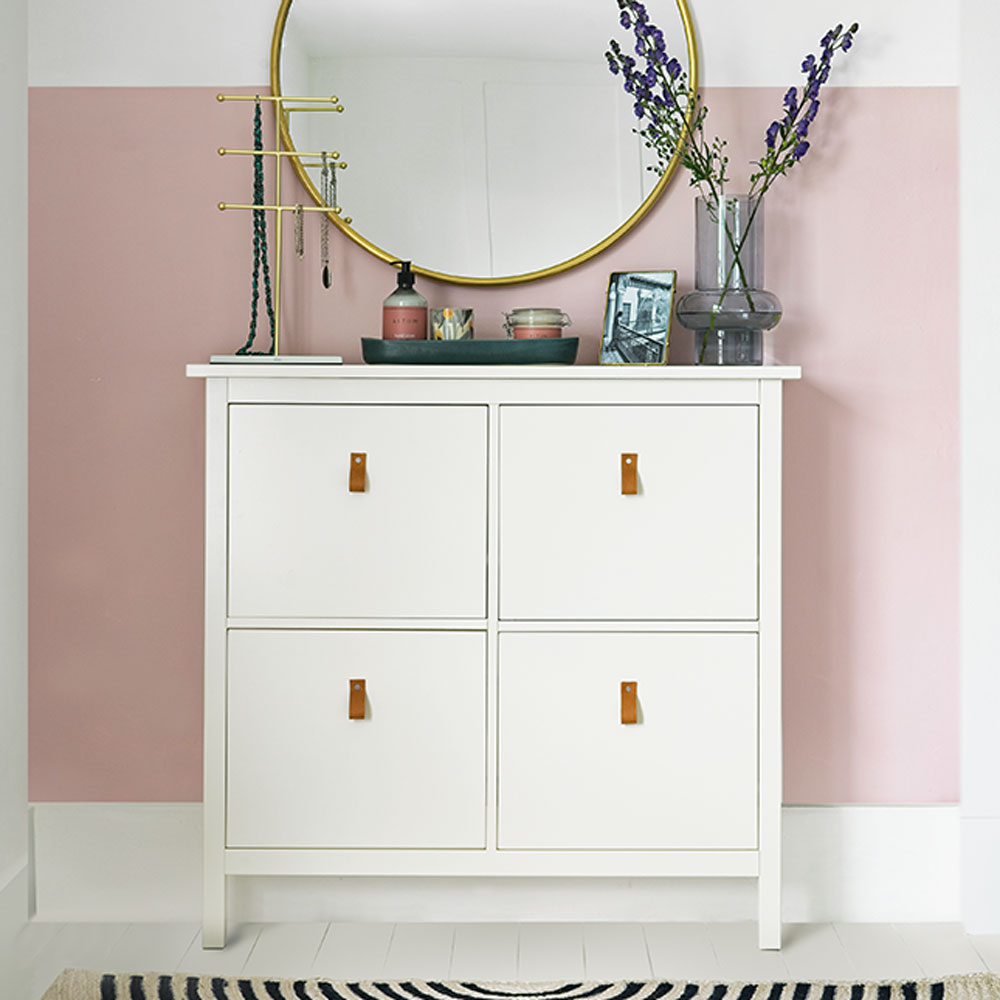 room with white cupboard and walled mirror