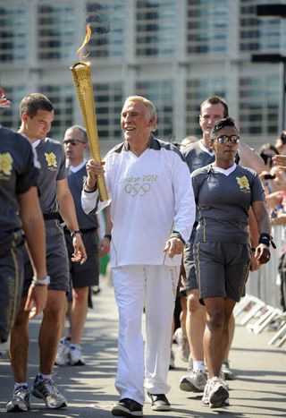 Brucie carries Olympic torch at original site