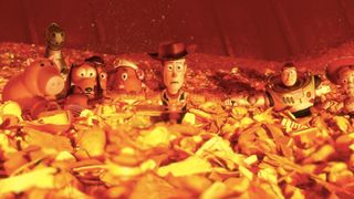 Andy's Toys approach a raging garbage fire in Toy Story 3