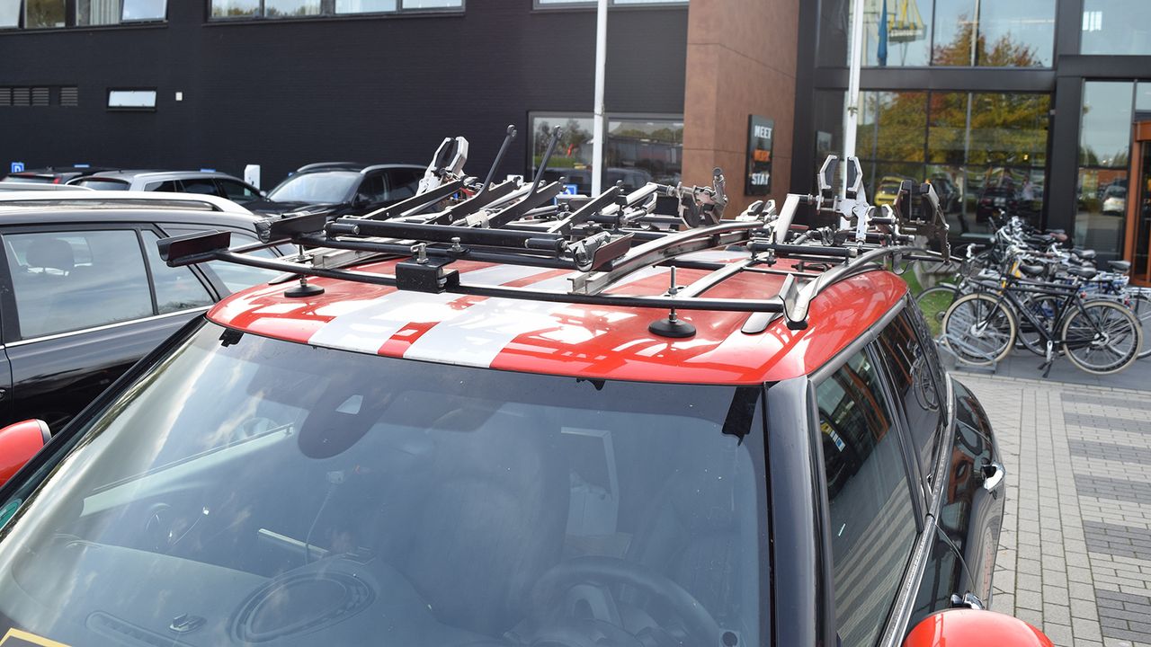 The roof rack has enough room for nine team bikes
