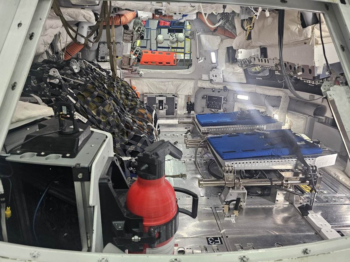 A photo showing the interior of a spacecraft capsule.