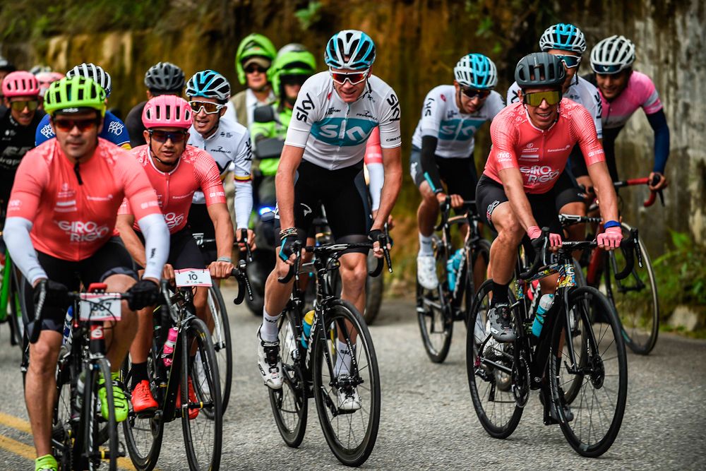 Chris Froome (C) rides next to Rigoberto Uran during the Giro de Rigo ride in San Rafael