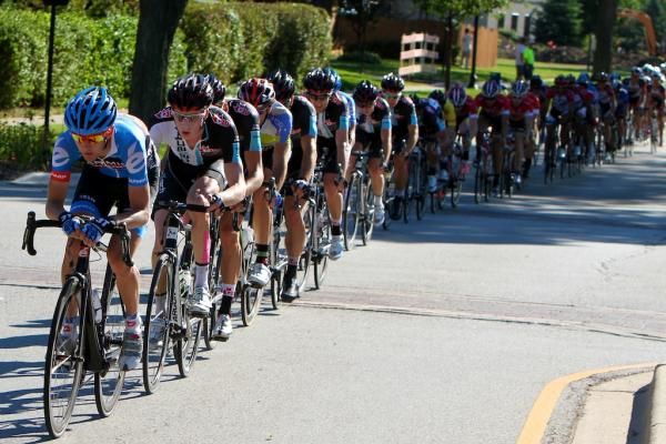 The field is strung out leading into the final kilometres of stage three