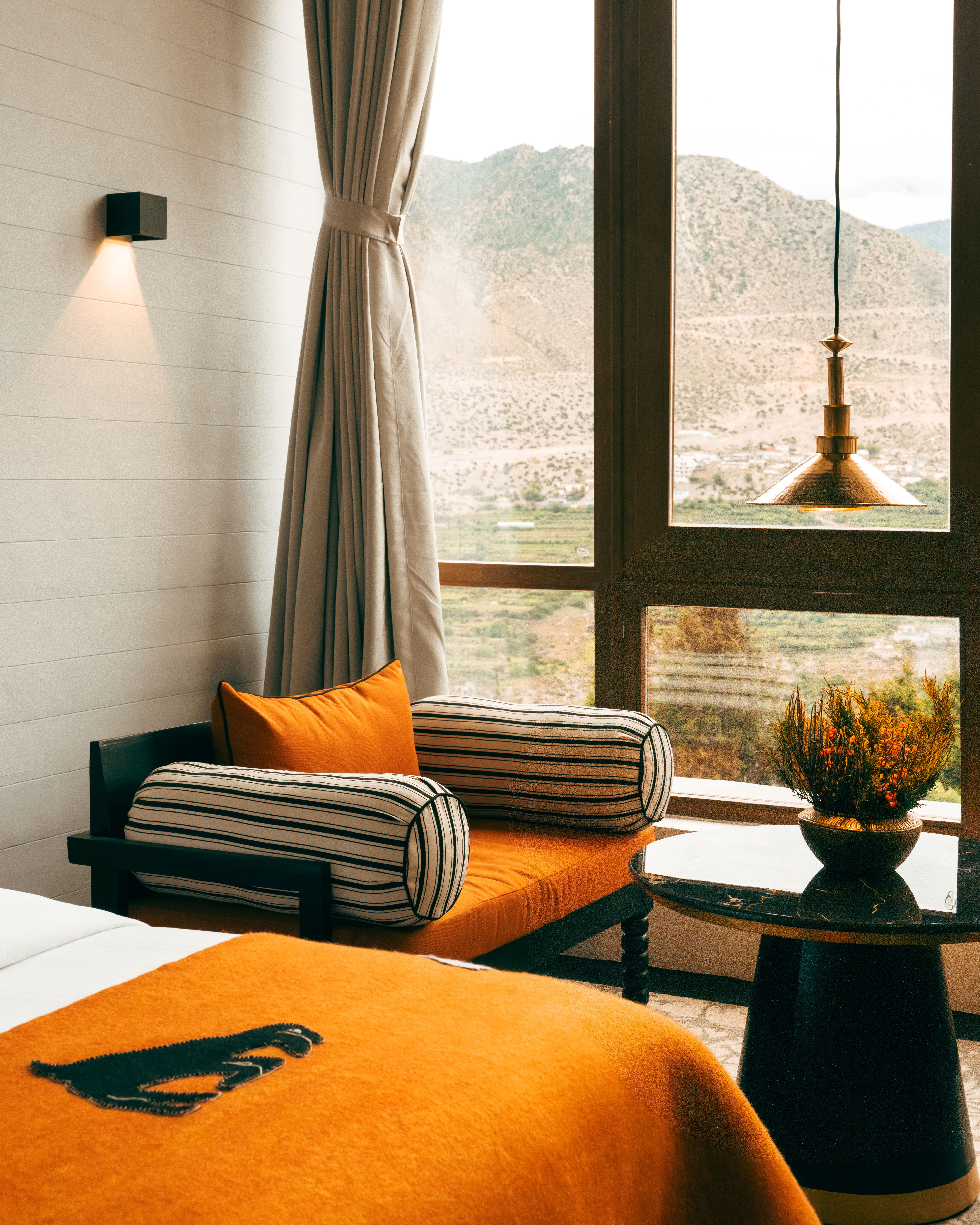 Shinta Mani Mustang bedroom with orange bed cover and upholstery