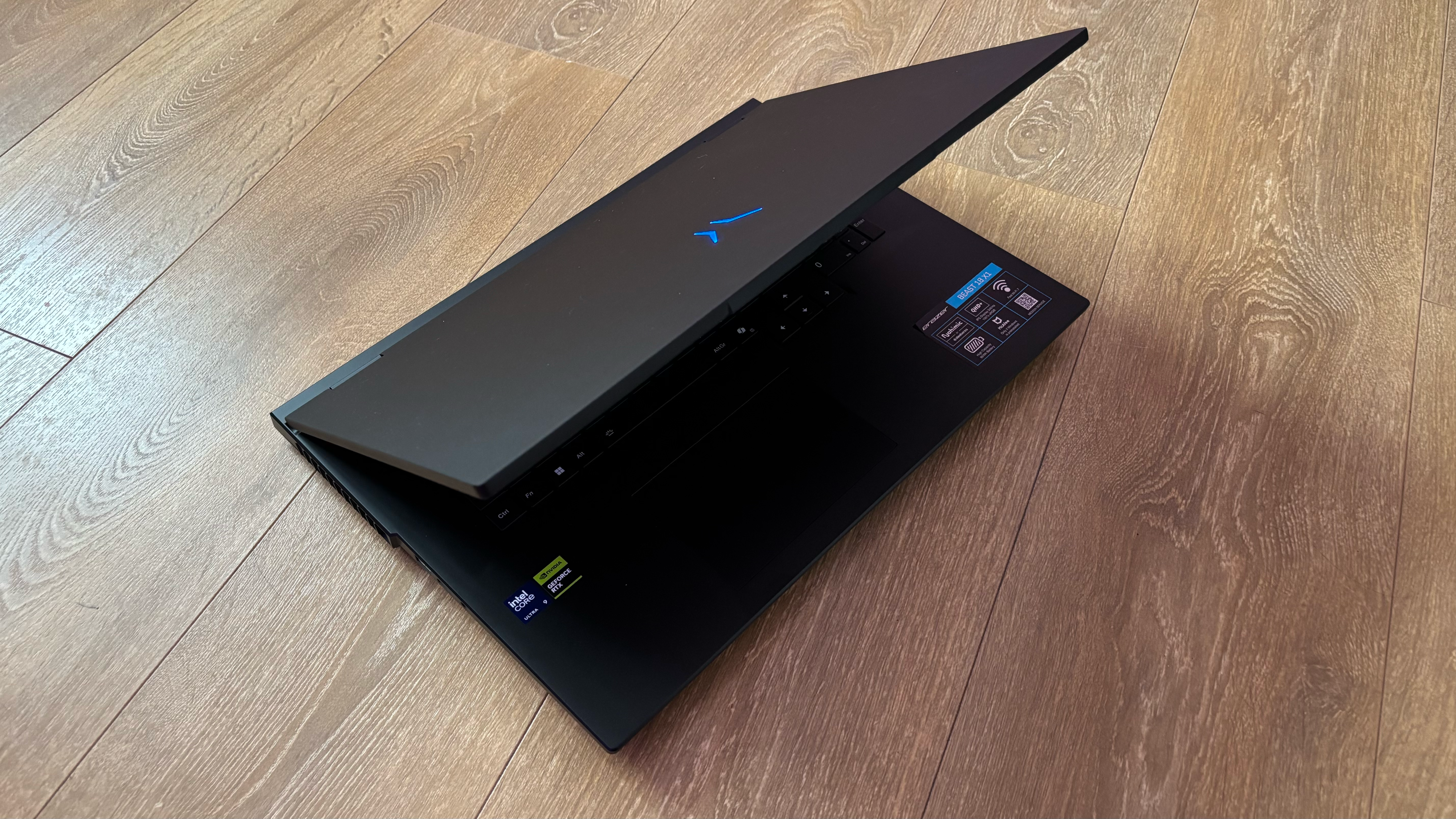 Medion Erazer Beast 18 gaming laptop on wooden floor