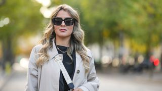 woman wears black square sunglasses