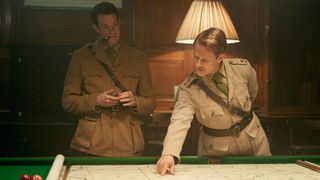 Stirling (Connor Swindells) and Jock (Alfie Allen) look at a map in SAS Rogue Heroes