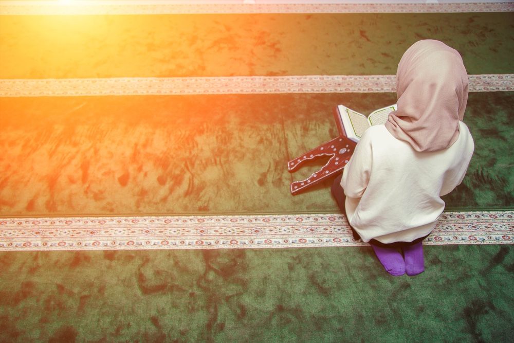 Muslim Woman Reading Holy Quran