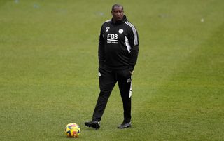 Emile Heskey walking on the pitch ahead of a WSL match between Liverpool and Leicester