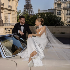 @leoniehanne wears wedding dress on car with husband