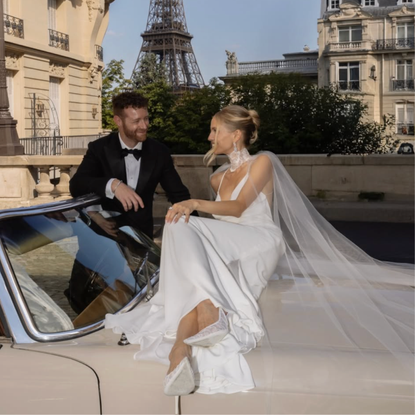 @leoniehanne wears wedding dress on car with husband