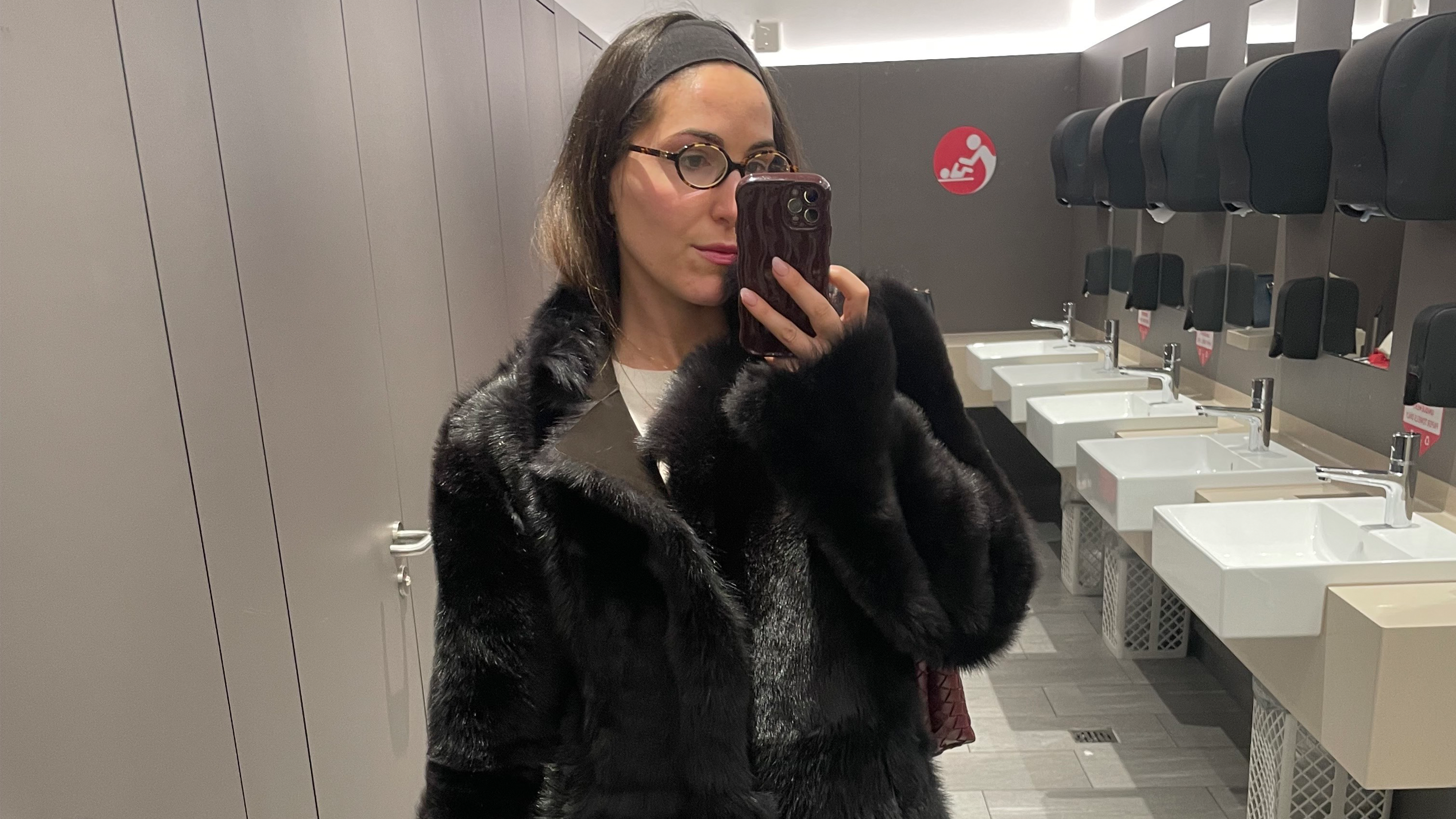 senior fashion editor Anna LaPlaca wearing a faux fur coat at the airport