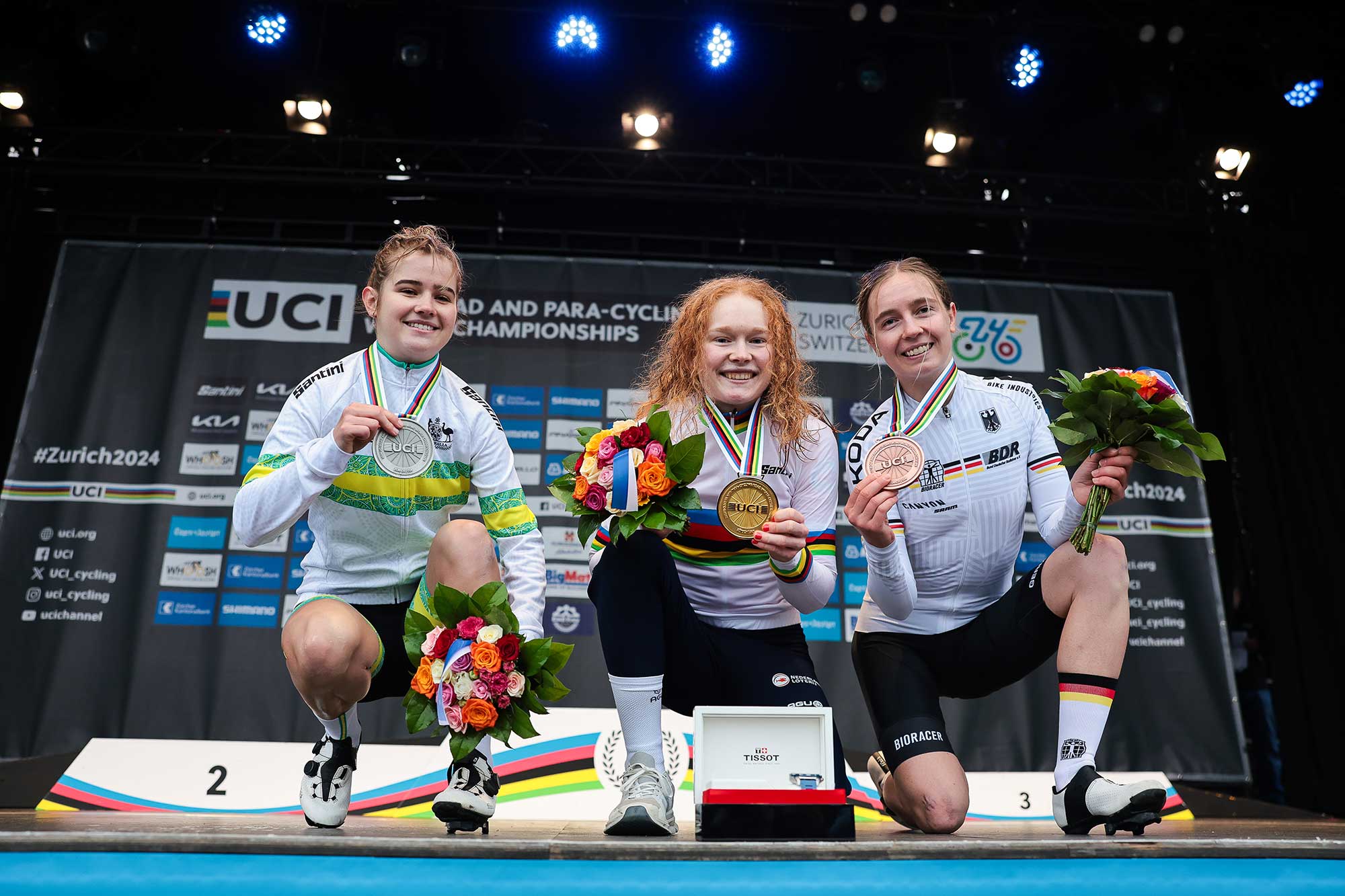 Picture by Alex WhiteheadSWpixcom 28092024 2024 UCI Road and Paracycling Road World Championships Zurich Switzerland Womens U23 Road Race Podium Puck Pieterse Netherlands on the podium receiving the Gold Medal to become World Champion Neve Bradbury Australia receiving the Silver Medal and Antonia Niedermaier Germany receiving the Bronze Medal