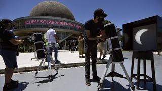 The partial solar eclipse is seen trough a telescope at the Galileo Galilei planetarium in Buenos Aires, on Dec. 14, 2020.