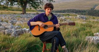 Chris Brain, the British folk singer-songwriter, plays his Sigma 12-fret acoustic in a rural setting
