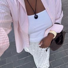@nnennaechem outfit selfie with pink shirt white tank and white lace skirt