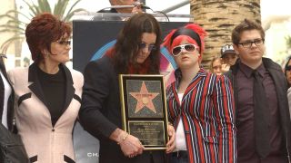 Ozzy Osbourne poses with his wife Sharon, daughter Kelly and son Jack during the ceremony honouring him with a star on the Hollywood Walk of Fame April 12, 2002 in Hollywood, CA.