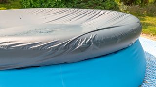 Blue circular inflatable pool with cover