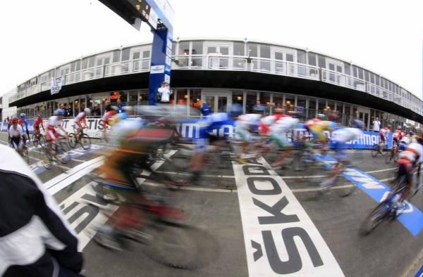 The riders flash through the finish area