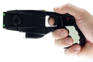 Hand holding a Taser