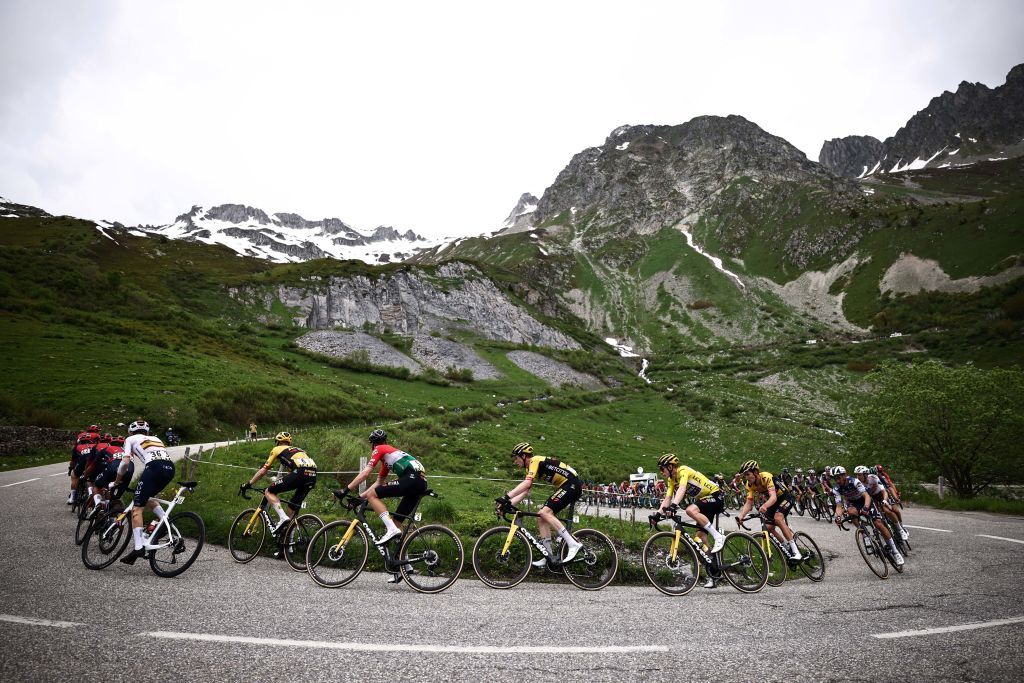 Yellow jersey of overall leader JumboVismas Danish rider Jonas Vingegaard CR rides with the pack during the seventh stage of the 75th edition of the Criterium du Dauphine cycling race 148km between Port de Savoie to Col de la Croix de Fer Saint Sorlin France on June 10 2023 Photo by AnneChristine POUJOULAT AFP Photo by ANNECHRISTINE POUJOULATAFP via Getty Images