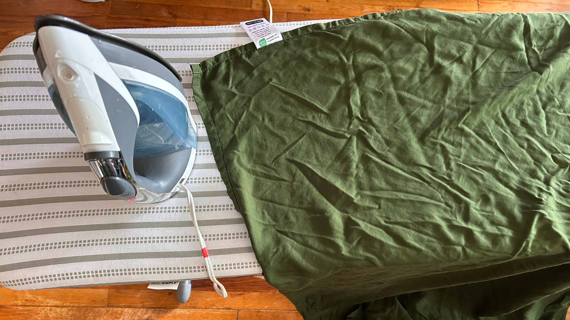 Sijo Airyweight Eucalyptus sheet set on the ironing board post-washing and drying