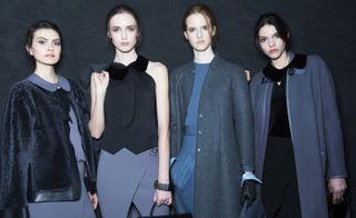 Female models wearing blue, grey and black clothes from the Giorgio Armani A/W 2015 collection