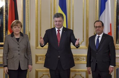 Merkel and Hollande are introduced by the Ukrainian President. 