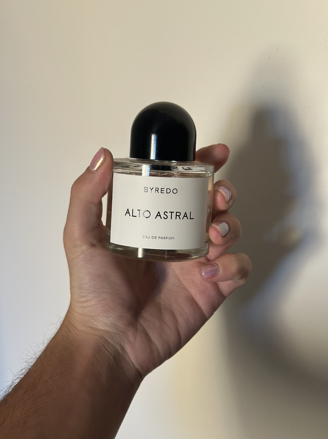 David Evan Ruff holding Byredo Alto Astral