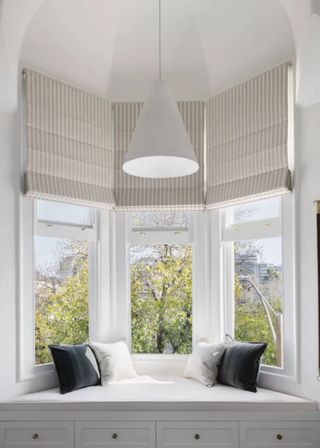 white oriel window with window seat storage