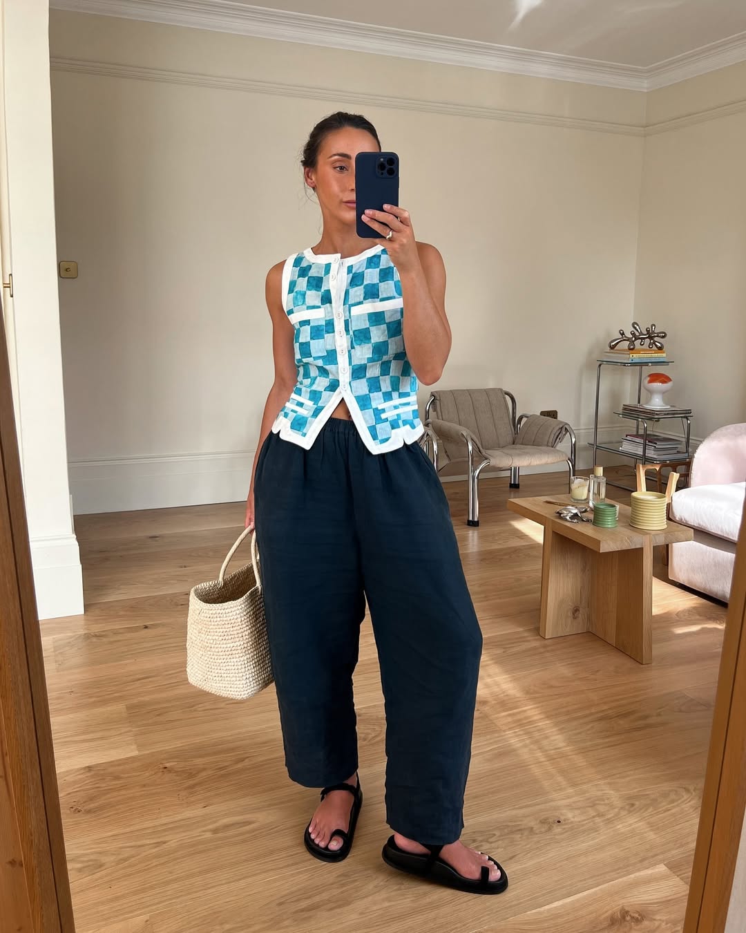 @emswells wears navy linen trousers