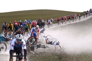 Julian Alaphilippe crashed due to strong winds during the 2022 Strade Bianche but was not injured 