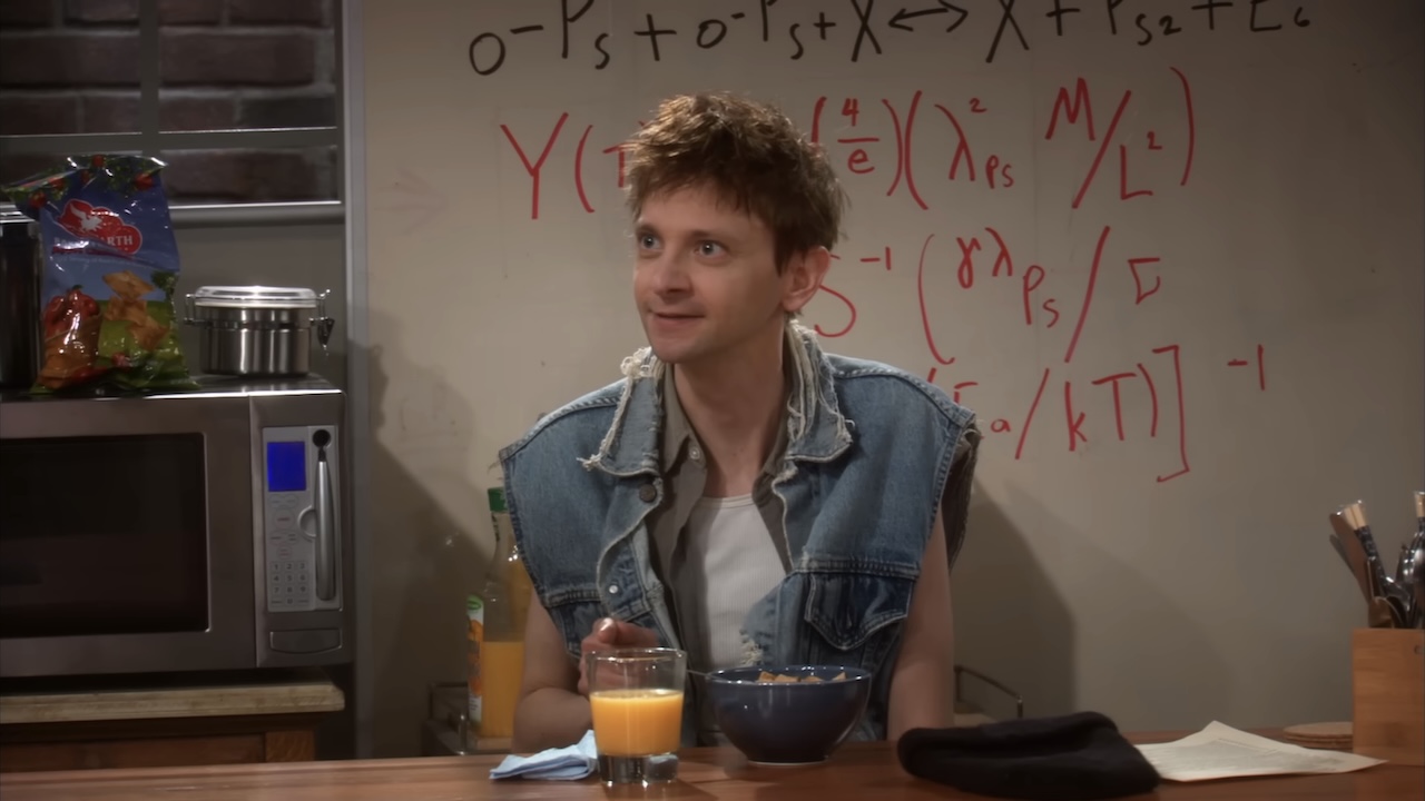 DJ Qualls sitting in The Big Bang Theory's kitchen set of Leonard and Sheldon's apartment