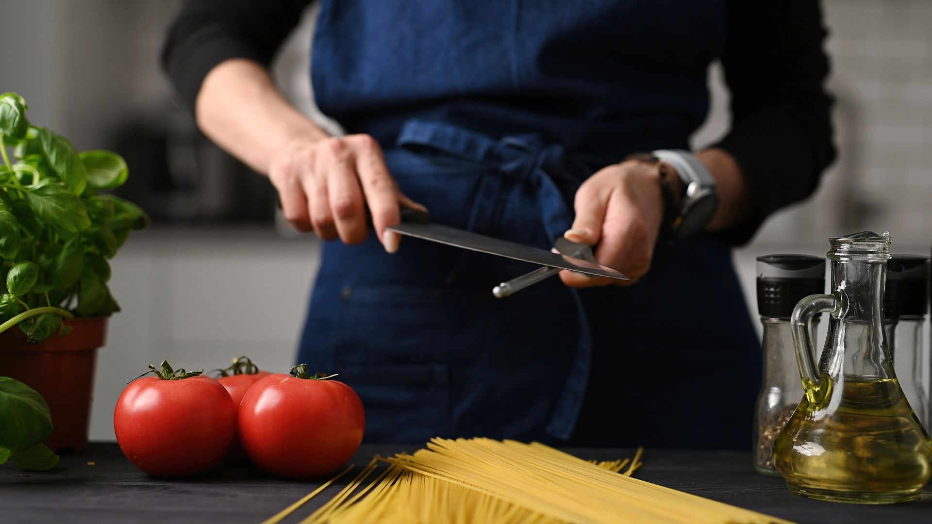 Woman sharpening a knife