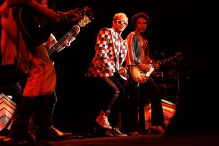 (L-R) Elton John and guitarist Caleb Quaye perform at the Omni Coliseum on July 16, 1976 in Atlanta, Georgia